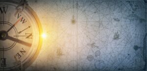 Pirate and nautical theme grunge background. Old sea compass on abstract map background. Retro style.